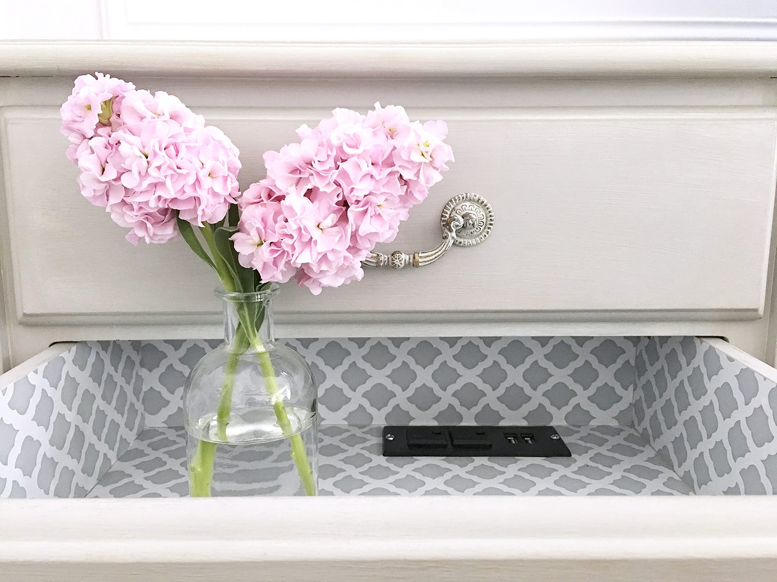 Cover the top of an old dresser with shelf paper and modge podge