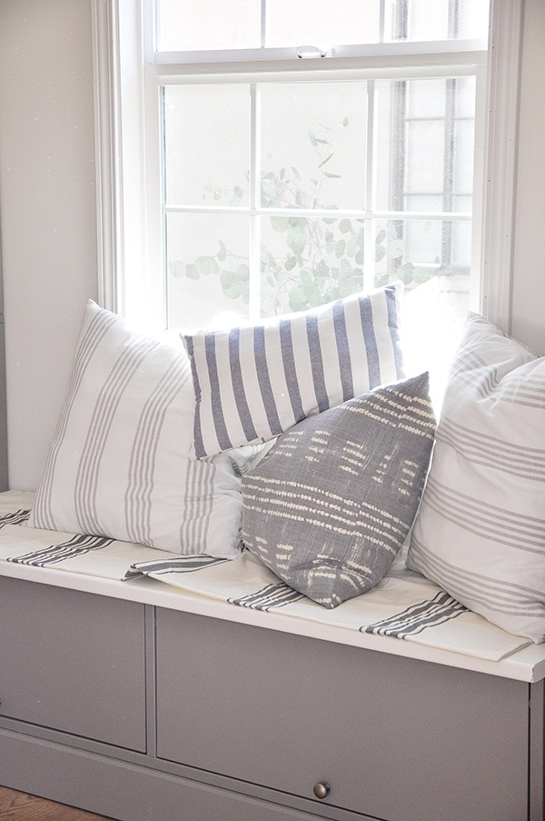 DIY decorative throw pillows in stripe fabric, on window seat, ikea dish towel, world market stripe tablecloth