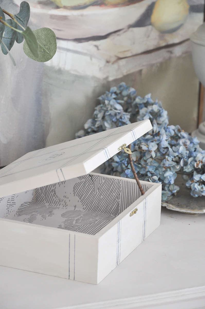 diy cigar box crafts project | anthropologie cloud formation wallpaper with blue dried hydrangea | console table vignette