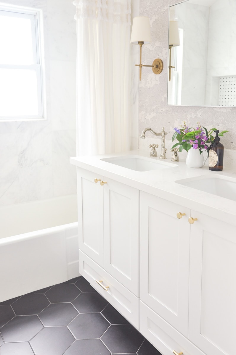 small master bathroom interior design, visual comfort bryant sconces, anthropologie cloud formation wallpaper, white double vanity, black hex tile