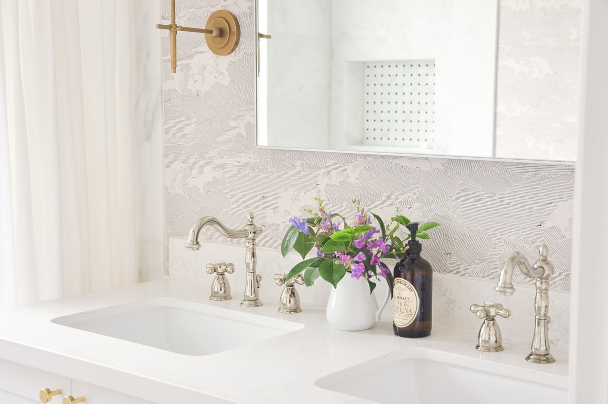 small master bathroom interior design, visual comfort bryant sconces, anthropologie cloud formation wallpaper, white double vanity, black hex tile