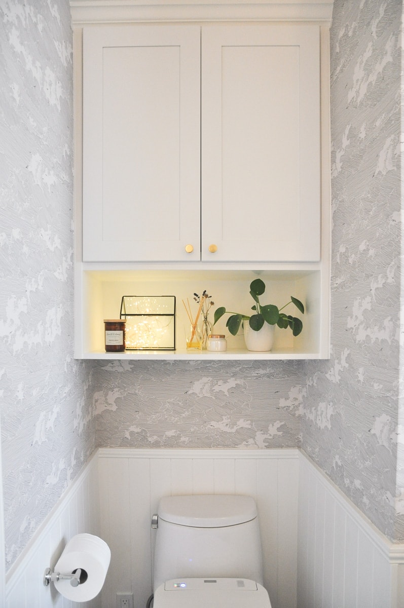 small bathroom remodel, master bath, above toilet vanity wall cabinet with shelf, hygge string light, pilea plant