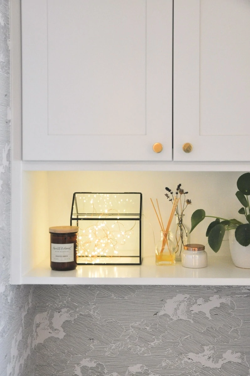 small bathroom remodel, master bath, above toilet vanity wall cabinet with shelf, hygge string light, pilea plant
