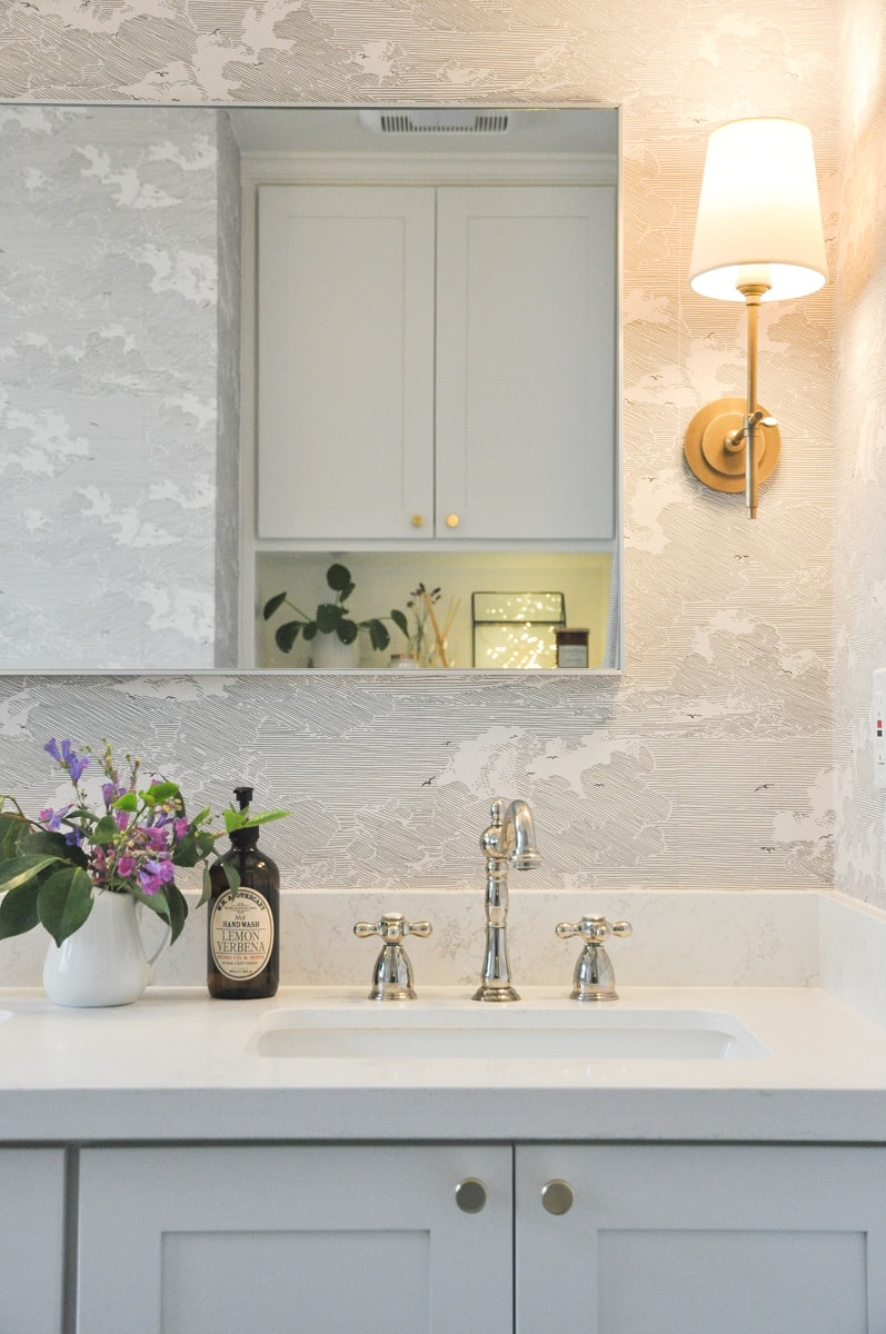 small bathroom remodel, master bath, above toilet vanity wall cabinet with shelf, hygge string light, pilea plant