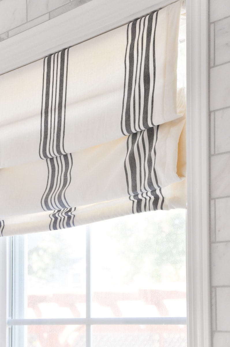 photo of modern farmhouse blinds in kitchen above sink