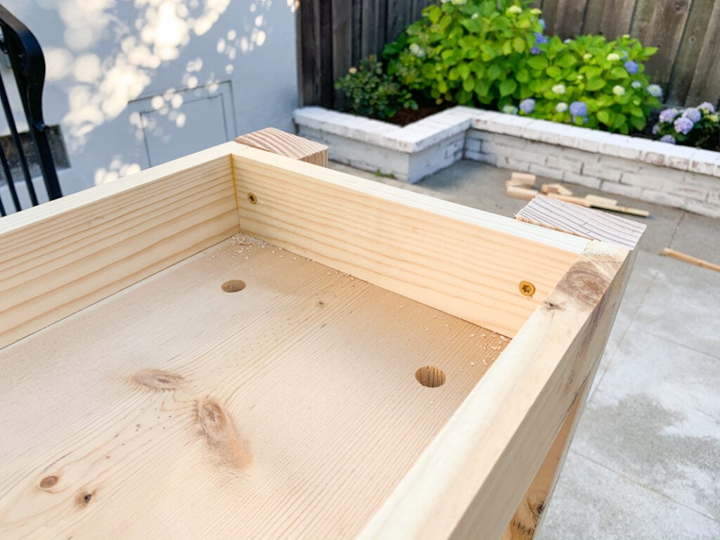 DIY outdoor plant shelves with drainage holes