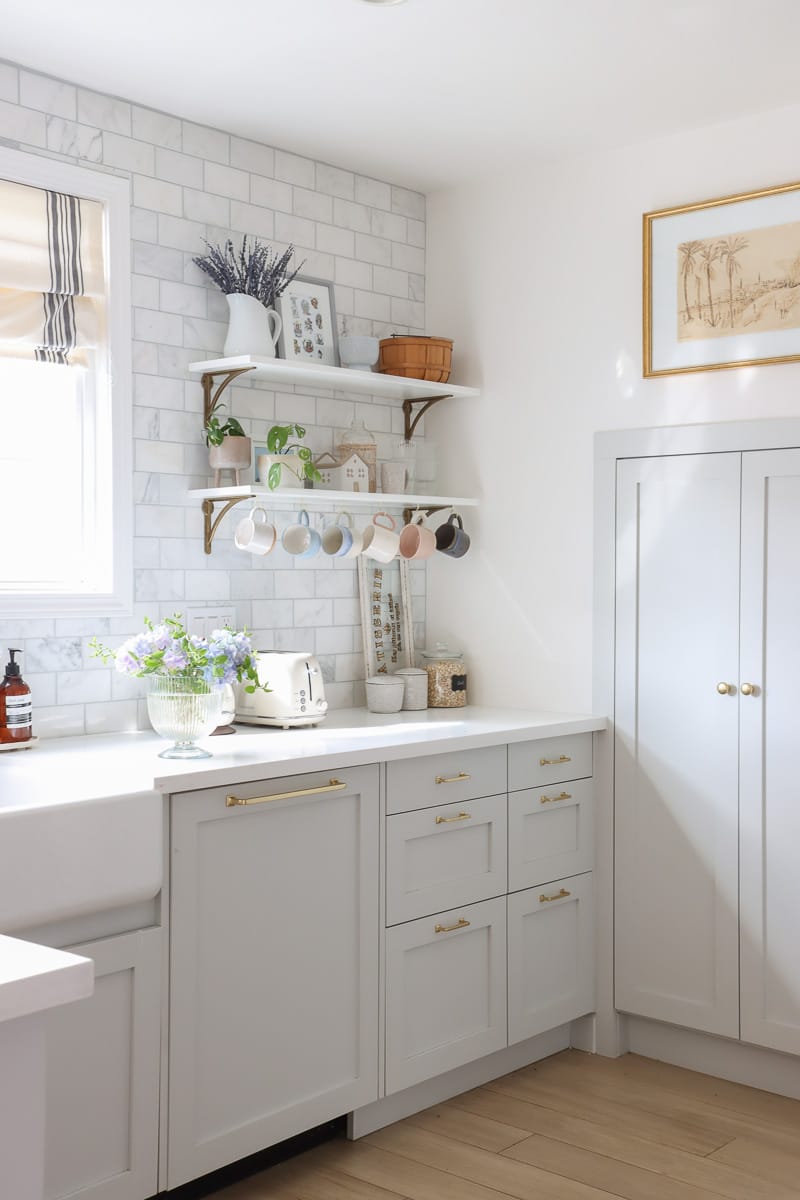 DIY your own open shelves with coffee mug holders adds both functionalities and style to your kitchen
